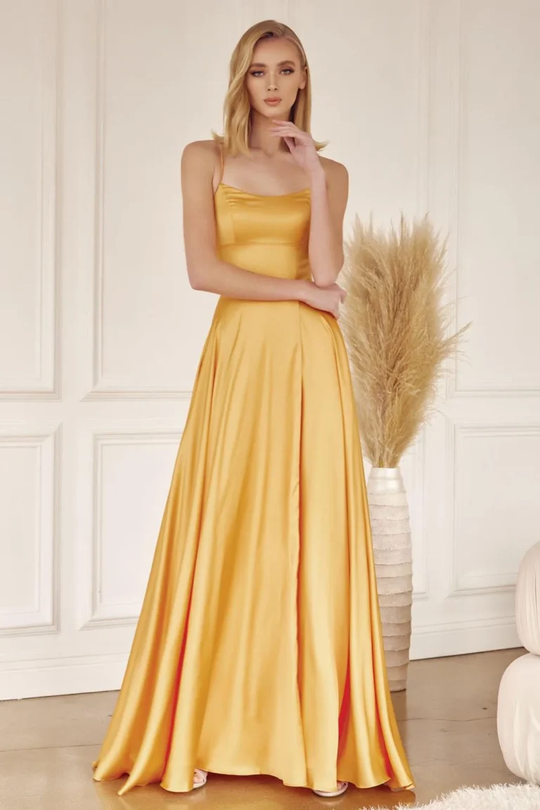 Gold satin gown with a scoop neck, pockets and full skirt